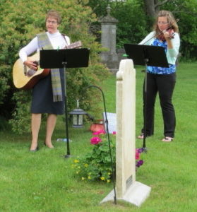 Norma Sedgwick (left, 3X great grand daughter-in-law on guitar) and Grace Taylor (right, 4X great grand daughter on violin) singing and playing 'The Girl I Left Behind Me,' a song from the War of 1812 era.