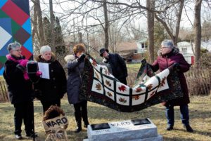 Susan Ferris, Linda Pavao, Sharon McDonald and Karen Goslin unveil the plaques.